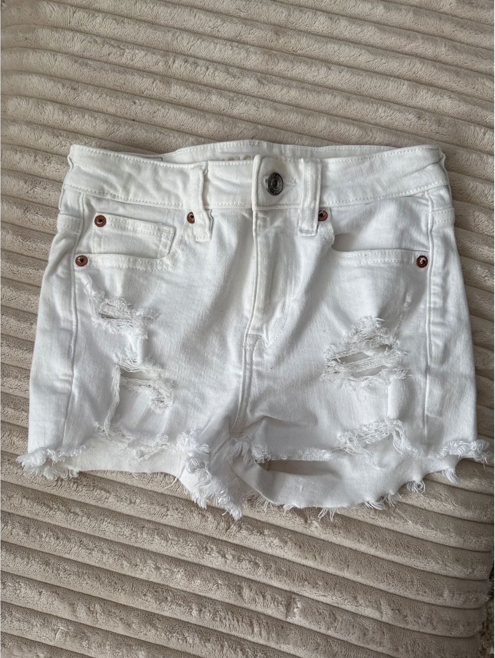 American Eagle, white denim distressed shorts size 00